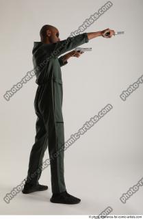 ERIC STANDING POSE WITH GUNS